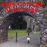 A stone arch with the words "One Mic Stand-up;s Park Comedy Jellicoe Park selected Tuesdays and Thursdays 7 to 8:30 PM