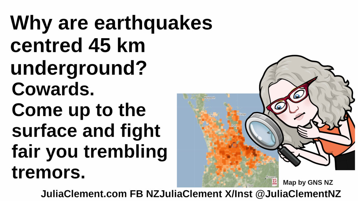 A comedian examines a North Island map with yellow & orange squares overlaid. Text: Why are earthquakes centred 45 km underground? Cowards! Come up to the surface and fight fair you trembling tremors.
