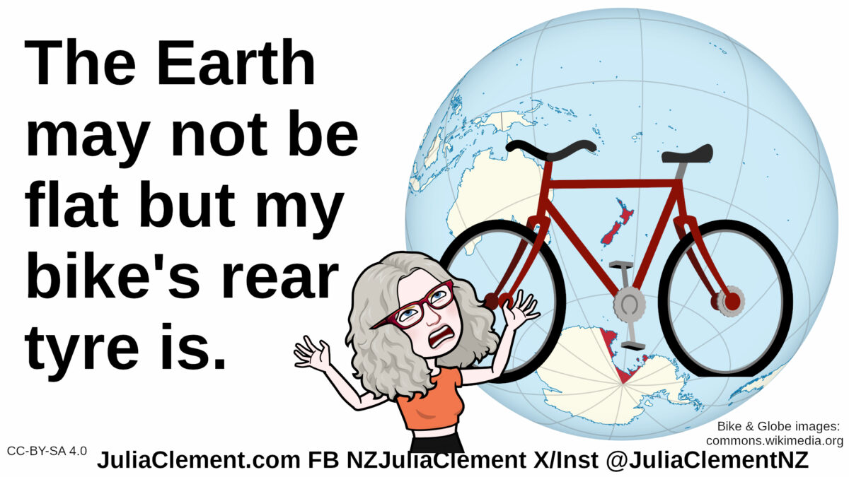 A comedian throwing her hands in the air in exasperation stands in front of a bicycle. Behind the bicycle is a globe of the Earth. Text: The Earth may not be flat but my bike's rear tyre is.