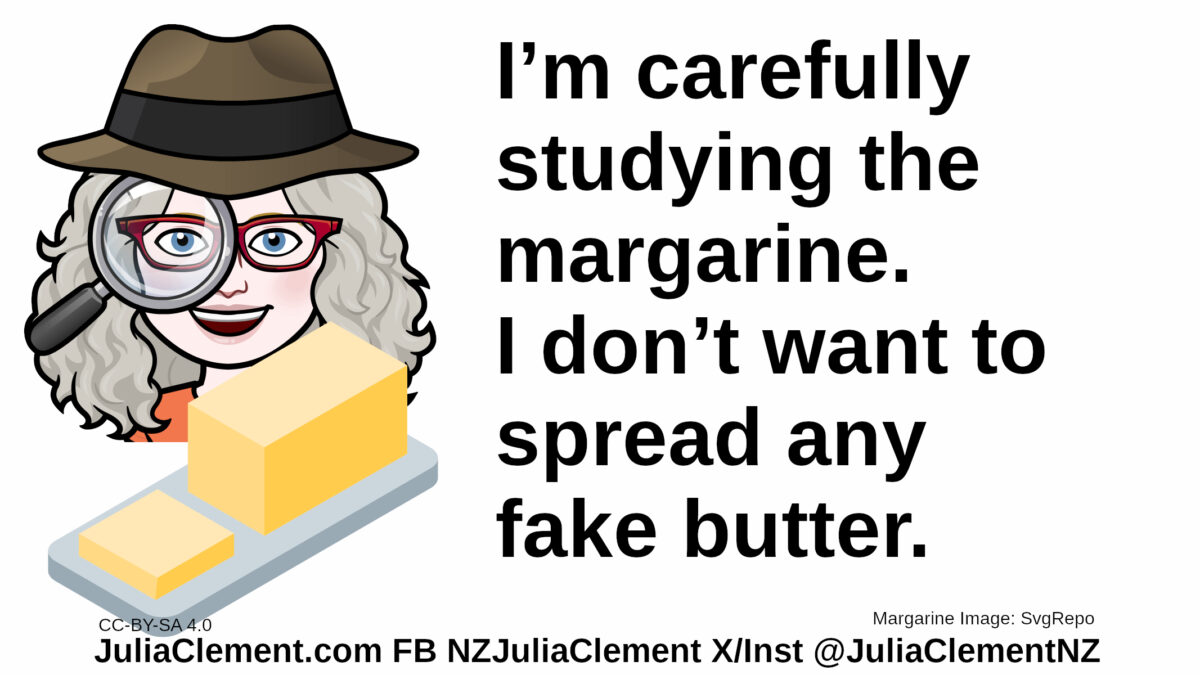 Julia, wearing a 1940s/50s detective hat, carefully studies a plate of margarine. Text: I’m carefully studying the margarine. I don’t want to spread any fake butter.