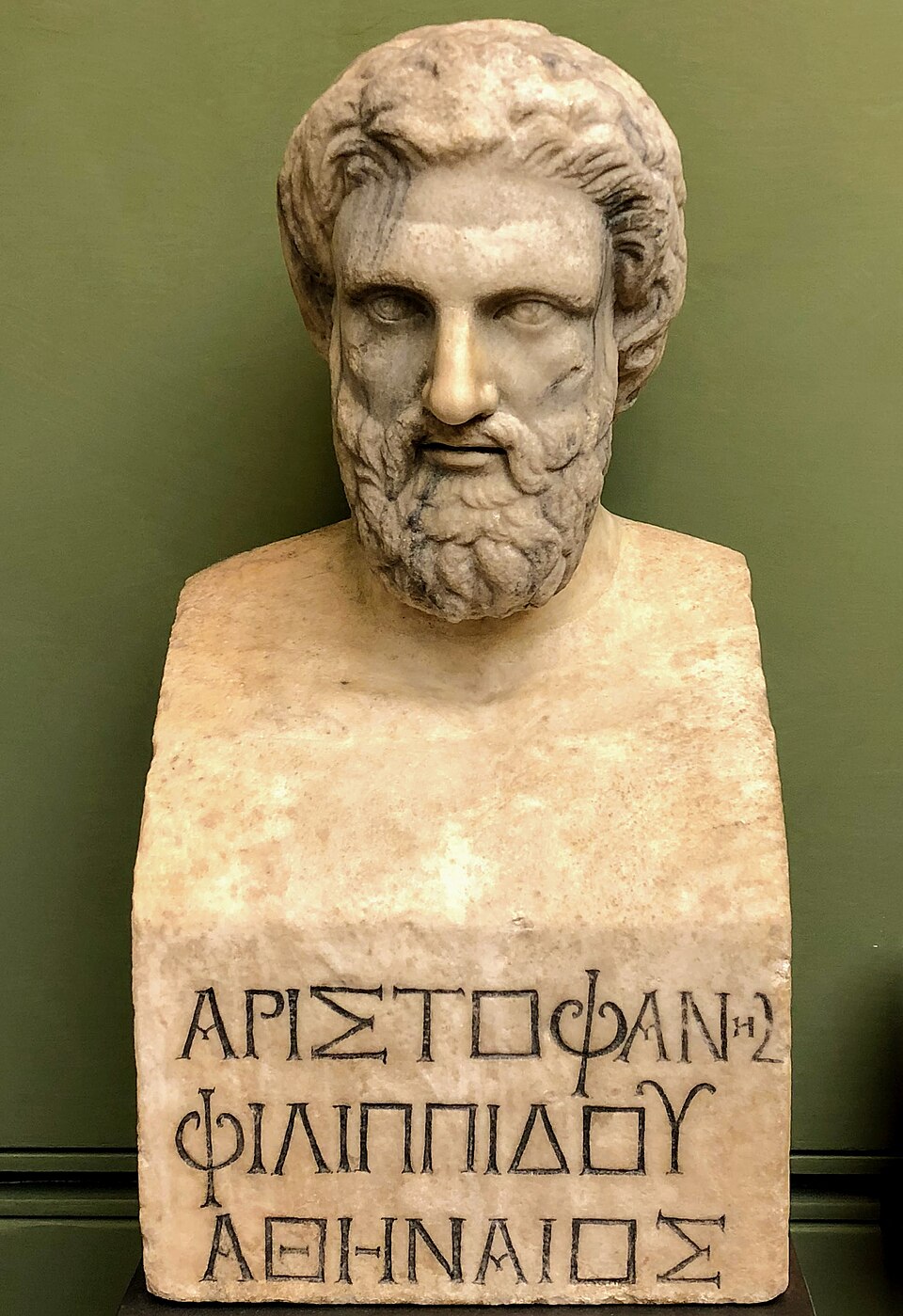 Bust of Aristophanes in the Uffizi Gallery, Florence, Italy. The text reads "ARISTOPHANES PHILIPPIDES[sic] THE ATHENSIAN" CC-BY-SA Alexander Mayatsky https://commons.wikimedia.org/wiki/File:Bust_of_Aristophanes.jpg